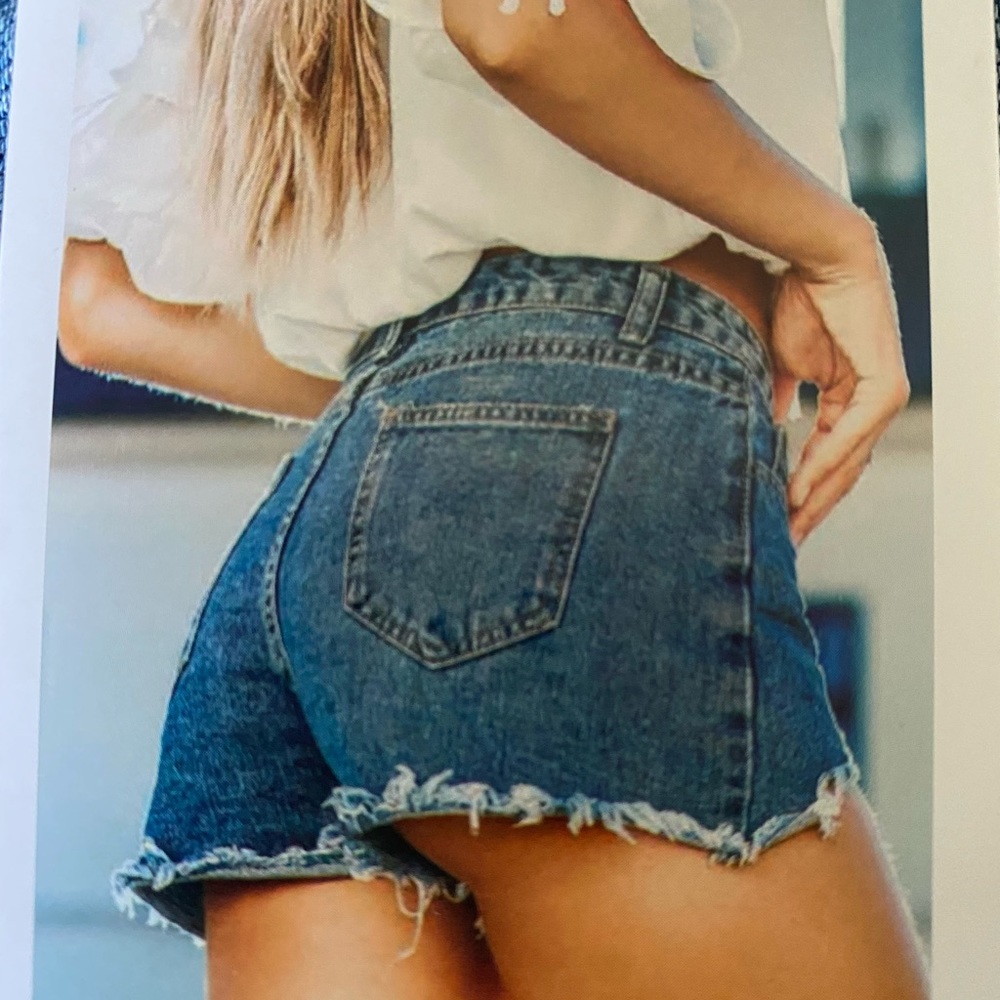 Distressed jean shorts. New with tags.